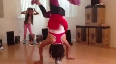 Girl does head spins on pop can